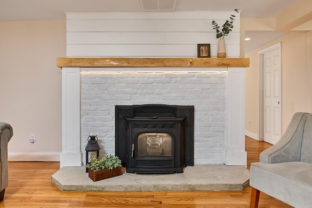 room details with visible vents, recessed lighting, baseboards, and wood finished floors