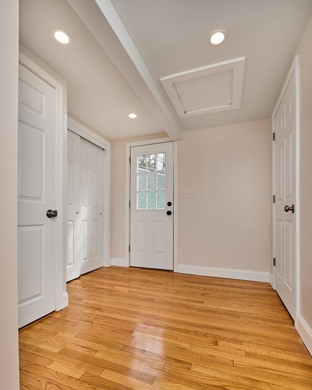 entrance foyer with baseboards, recessed lighting, and light wood finished floors