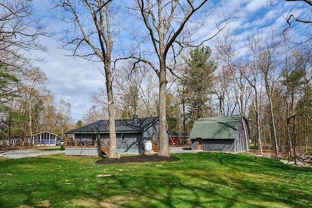 view of yard featuring a wooden deck