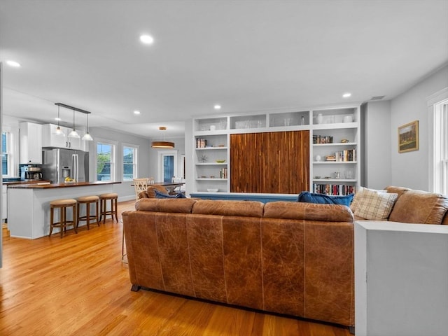 living room featuring light wood-style floors and recessed lighting
