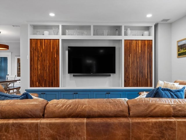 living area with recessed lighting and visible vents