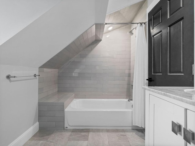 bathroom with vanity, baseboards, and shower / tub combo with curtain