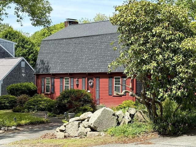 631 Elm St, Dartmouth, MA 02748 - view of front facade with a shingled roof and a chimney