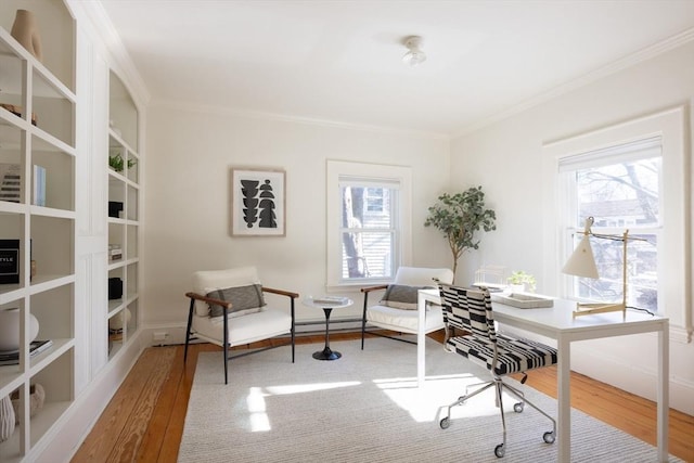 office area with ornamental molding and hardwood / wood-style flooring