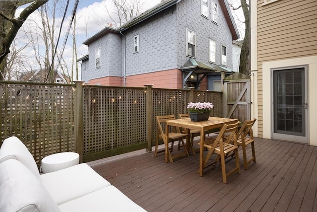 wooden deck featuring outdoor dining space