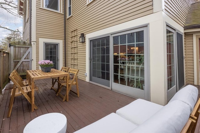 wooden terrace with outdoor lounge area