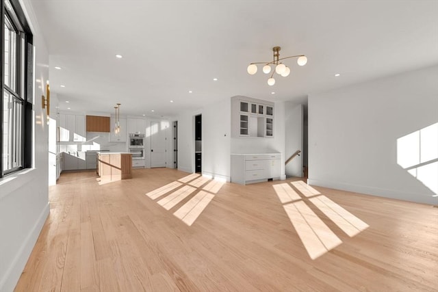 unfurnished living room featuring light hardwood / wood-style floors