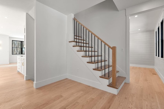 stairway featuring wood-type flooring