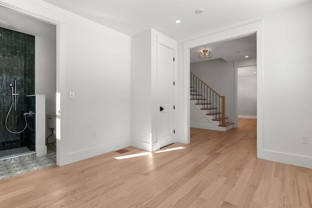 spare room featuring light wood-type flooring