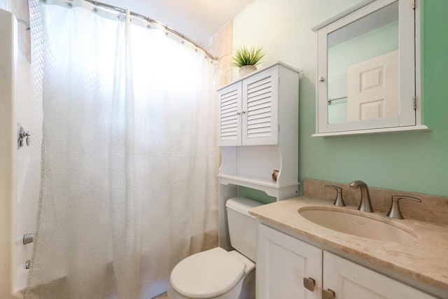 full bathroom featuring vanity, shower / bath combination with curtain, and toilet