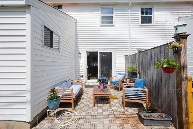 view of patio / terrace featuring fence and outdoor lounge area