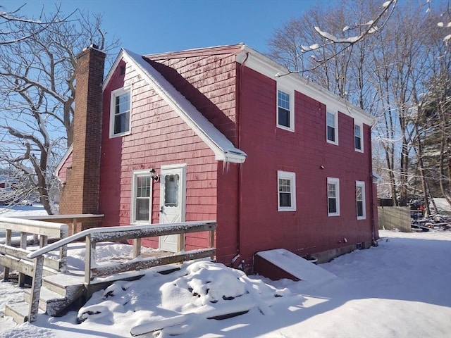 62 Chestnut St, Seekonk, MA 02771 - snow covered property with a chimney