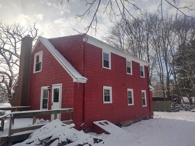 62 Chestnut St, Seekonk, MA 02771 - snow covered property with a chimney