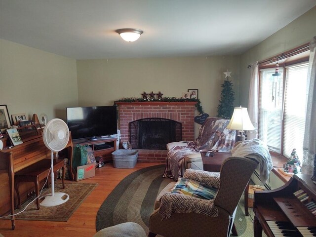 62 Chestnut St, Seekonk, MA 02771 - living room with a brick fireplace and wood finished floors