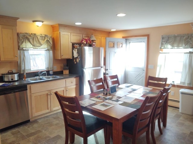 62 Chestnut St, Seekonk, MA 02771 - kitchen with a sink, dark countertops, light brown cabinets, and stainless steel appliances