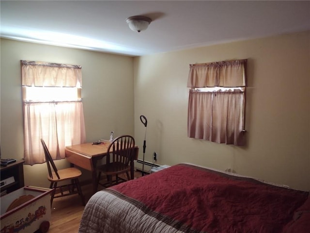 62 Chestnut St, Seekonk, MA 02771 - bedroom featuring a baseboard radiator and wood finished floors