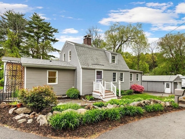 1 Woodman St, Gloucester, MA 01930 - view of front of property featuring a gambrel roof, a shingled roof, a chimney, and an outbuilding