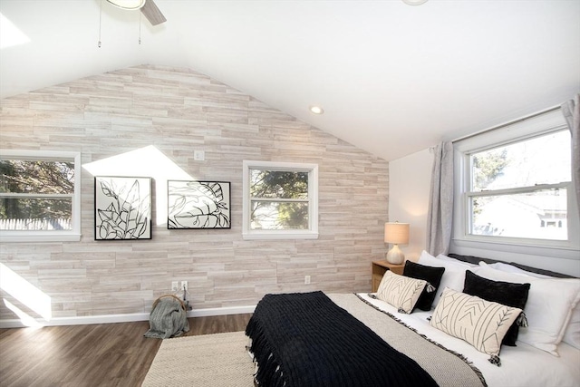 bedroom featuring vaulted ceiling and wood-type flooring