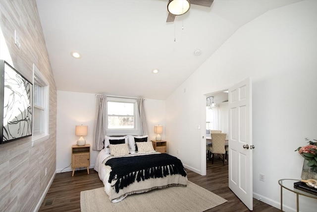 bedroom featuring vaulted ceiling, dark wood-type flooring, and ceiling fan