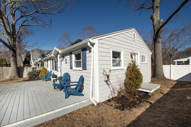 view of side of property featuring a deck