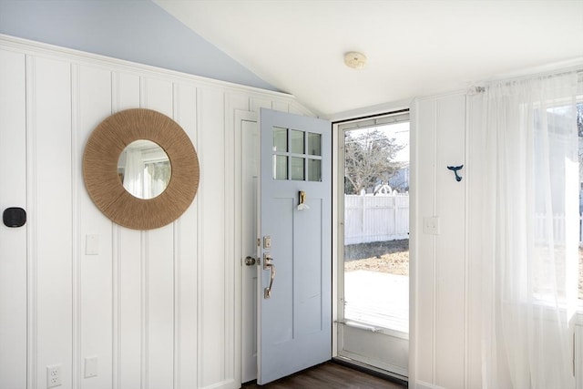 entryway featuring lofted ceiling and dark hardwood / wood-style floors