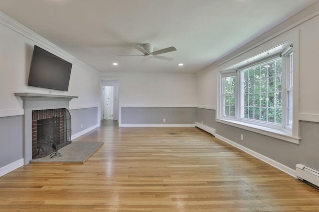 589 Turnpike, Ashby, MA 01431 - unfurnished living room featuring a baseboard radiator, a ceiling fan, crown molding, a fireplace, and light wood-style floors