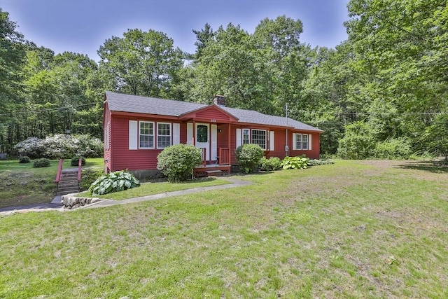 589 Turnpike, Ashby, MA 01431 - ranch-style house with a chimney, a front lawn, and roof with shingles