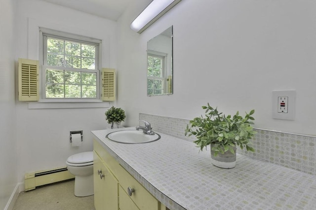 589 Turnpike, Ashby, MA 01431 - bathroom featuring baseboard heating, plenty of natural light, and vanity