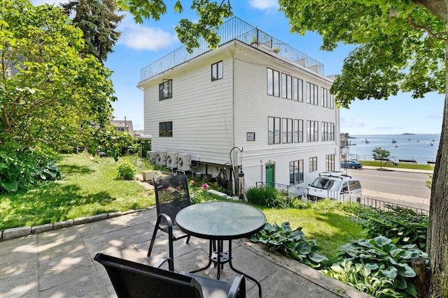 374 Humphrey St Unit 4, Swampscott, MA 01907 - rear view of house with a lawn, a patio, and a balcony
