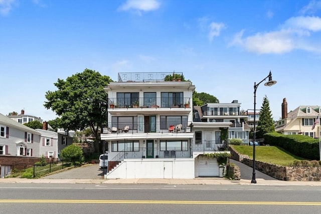 374 Humphrey St Unit 4, Swampscott, MA 01907 - view of front of home with a balcony, a residential view, stairway, and a garage