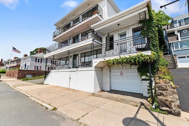 374 Humphrey St Unit 4, Swampscott, MA 01907 - view of property featuring a garage