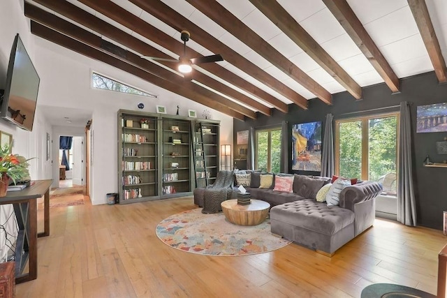living area featuring light wood-style floors, a ceiling fan, and plenty of natural light