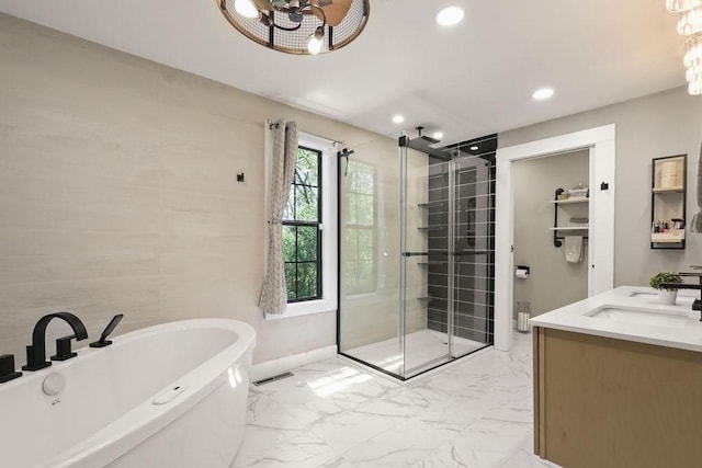 full bathroom with a stall shower, marble finish floors, recessed lighting, a freestanding bath, and baseboards