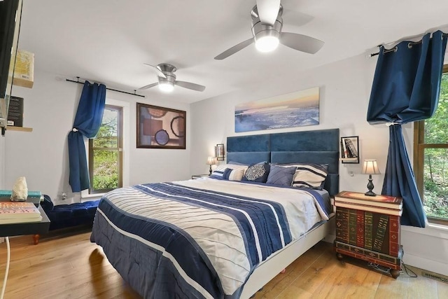 bedroom featuring hardwood / wood-style floors and ceiling fan