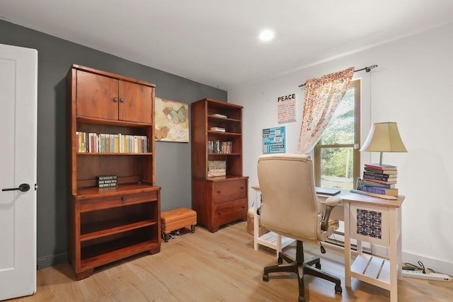 home office featuring light wood-type flooring and recessed lighting