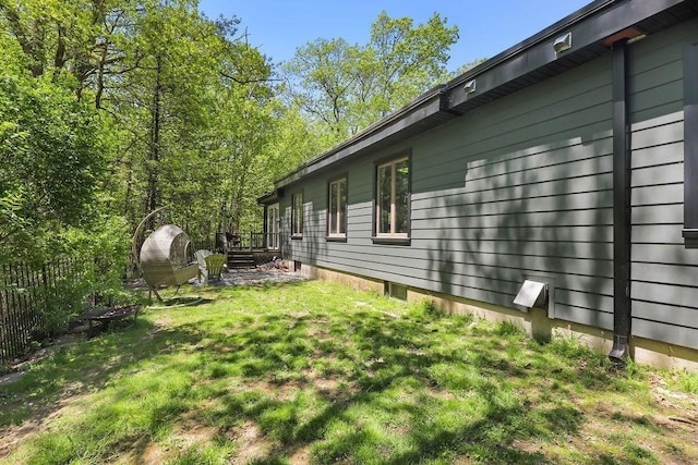 view of side of home with a wooden deck
