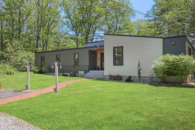 view of front of property with a front lawn