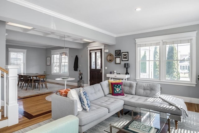 living room featuring baseboards, recessed lighting, crown molding, and wood finished floors