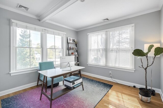 home office with ornamental molding, baseboards, visible vents, and beam ceiling