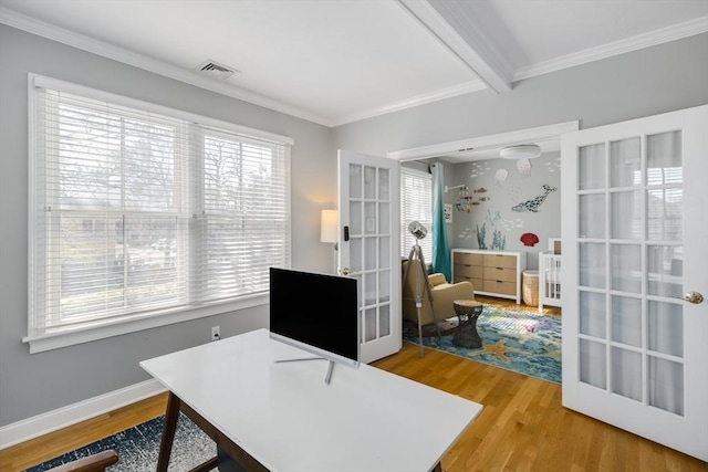 office area with beam ceiling, light wood finished floors, french doors, and visible vents