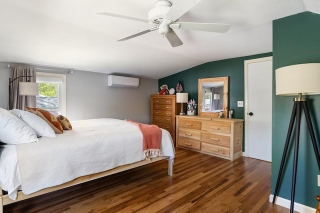 bedroom featuring ceiling fan, an AC wall unit, dark wood finished floors, and lofted ceiling