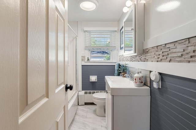 bathroom featuring vanity, marble finish floor, toilet, and shower / bathing tub combination