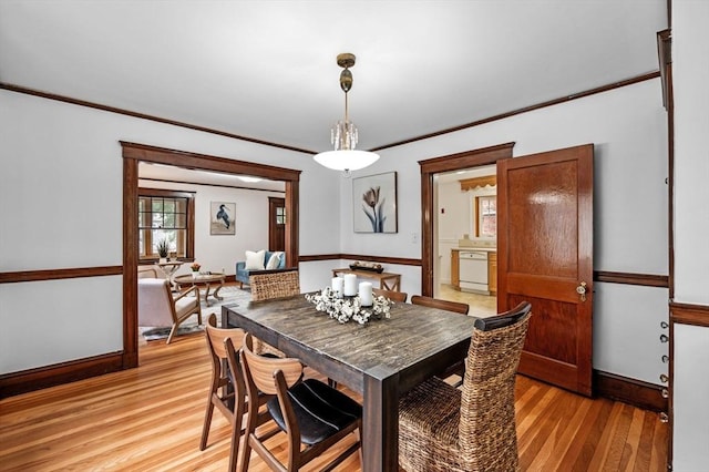 33 Intervale Ave, Saugus, MA 01906 - dining area featuring light wood-type flooring and crown molding