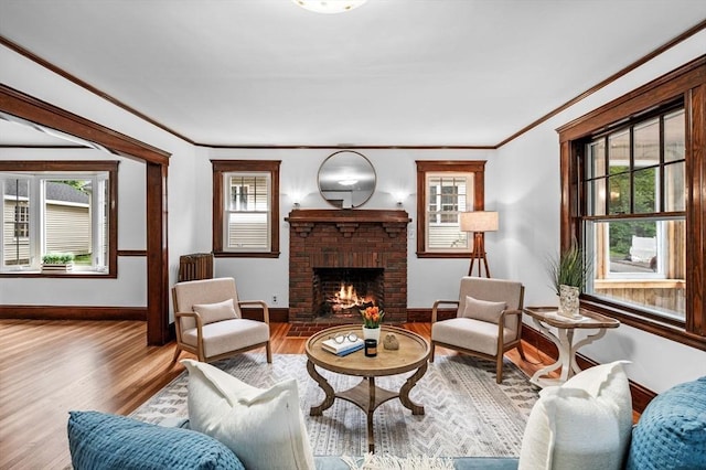 33 Intervale Ave, Saugus, MA 01906 - living room with wood finished floors, plenty of natural light, crown molding, and a fireplace