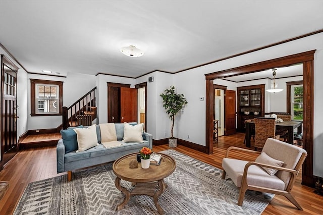 33 Intervale Ave, Saugus, MA 01906 - living area featuring ornamental molding, hardwood / wood-style flooring, plenty of natural light, and stairway