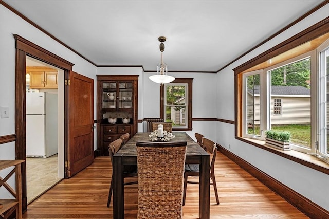 33 Intervale Ave, Saugus, MA 01906 - dining room featuring light wood finished floors and ornamental molding