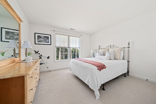 bedroom with light colored carpet