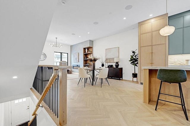 dining area featuring recessed lighting, baseboards, and an inviting chandelier