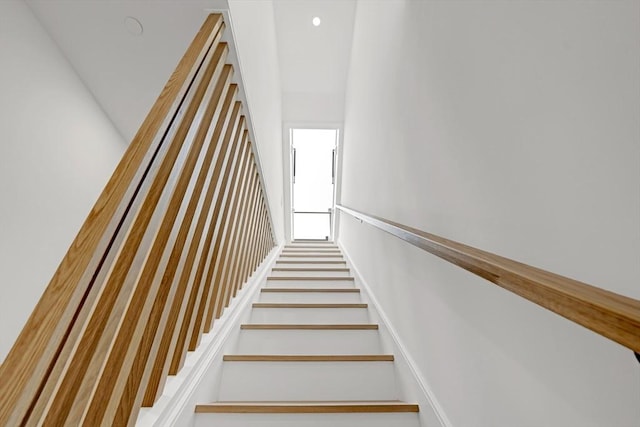 staircase with recessed lighting