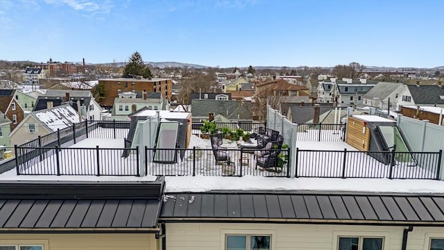 exterior space featuring a residential view and fence